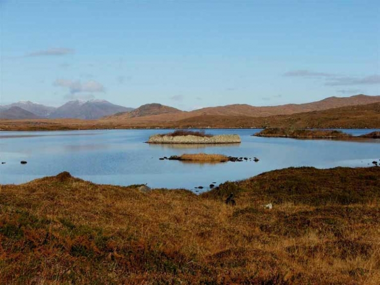 Lowered lake levels revel outer wall of a Crannóg.